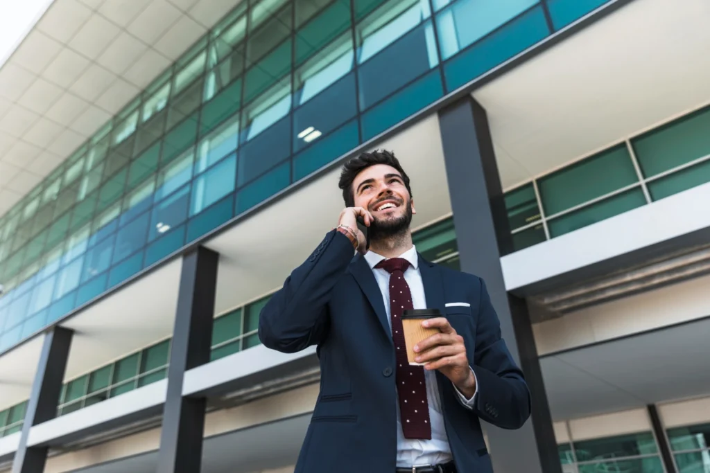 Business owner outside a corporate headquarters preparing for a sale and its tax consequences