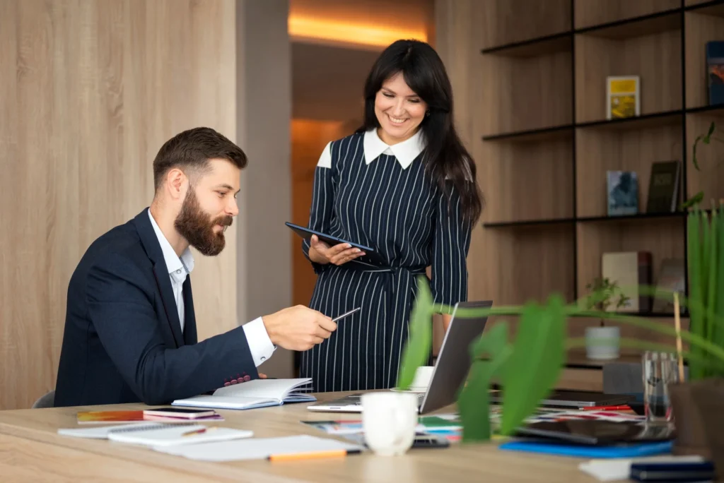 Business owner and advisor discussing a deductible executive bonus arrangement to fund compensation beyond the qualified-plan cap
