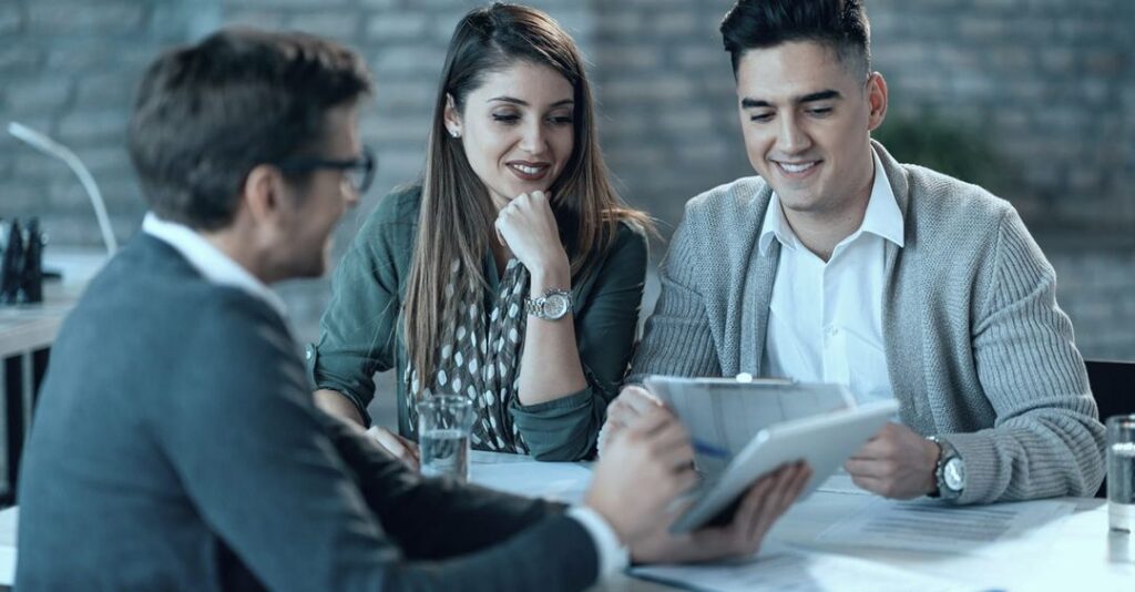 Three advisors reviewing documents together, representing the CPA, financial advisor, and estate attorney who each handle one piece of the account